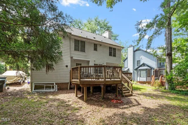 a view of a roof deck with wooden floor and fence