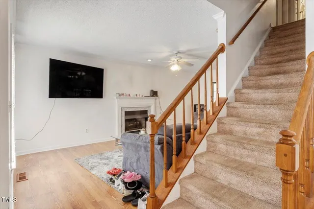 a backyard of a house with table and chairs