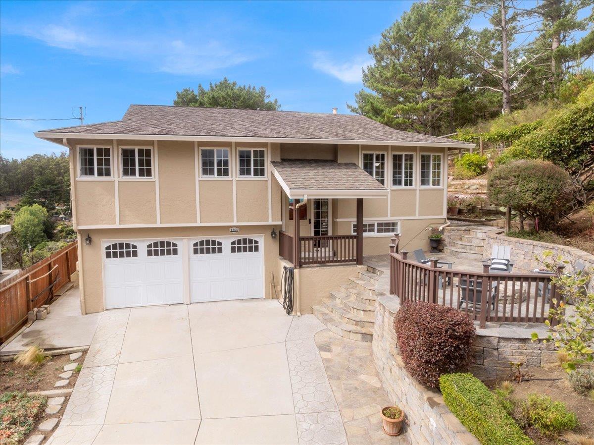 a view of house with outdoor seating