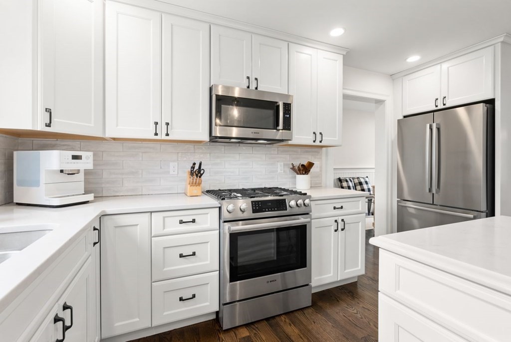 21 July Road Sudbury, MA 01776 - Photo 12 of 41 a kitchen with white cabinets and stainless steel appliances