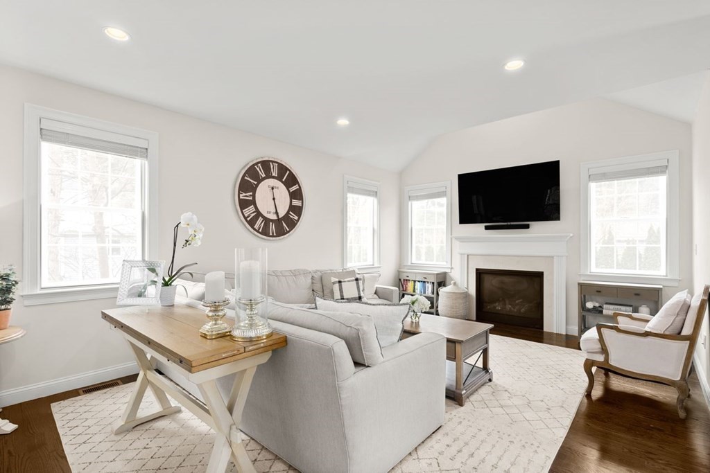 21 July Road Sudbury, MA 01776 - Photo 3 of 41 a living room with furniture a fireplace and a large window