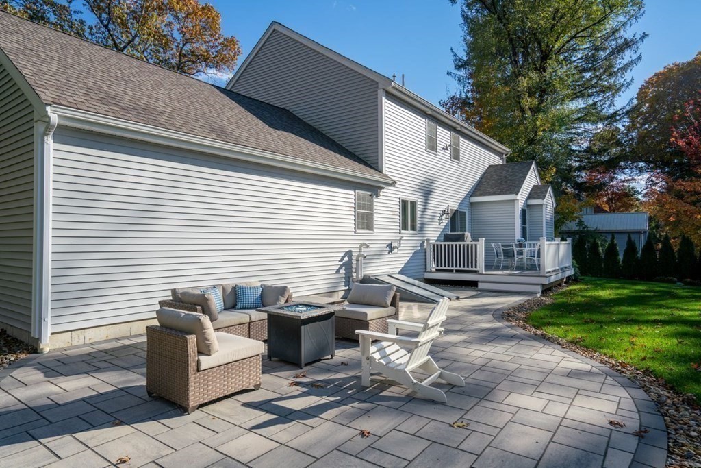 21 July Road Sudbury, MA 01776 - Photo 33 of 41 a backyard of a house with yard and outdoor seating