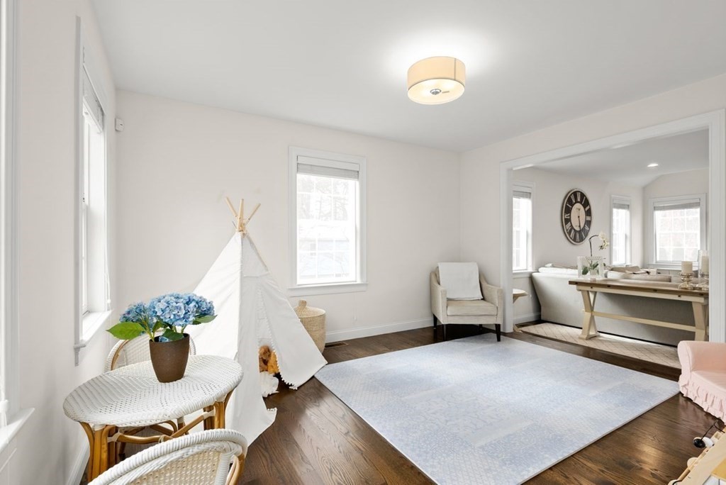 21 July Road Sudbury, MA 01776 - Photo 6 of 41 a living room with furniture and a chandelier