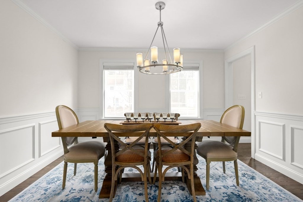 21 July Road Sudbury, MA 01776 - Photo 8 of 41 a dining room with furniture a chandelier and wooden floor