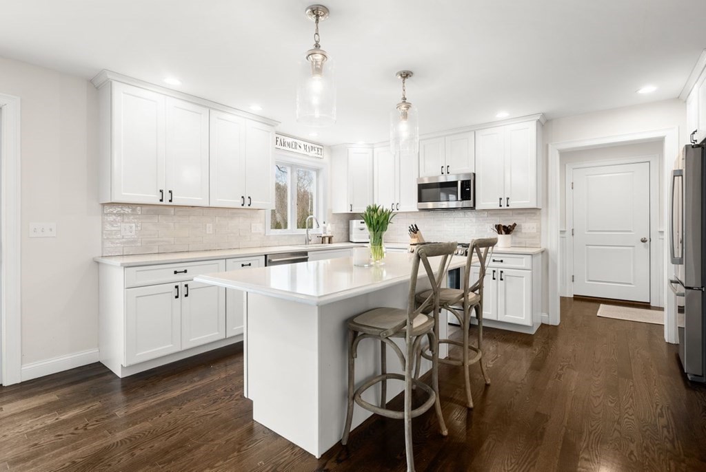 21 July Road Sudbury, MA 01776 - Photo 10 of 41 a kitchen with white cabinets and stainless steel appliances