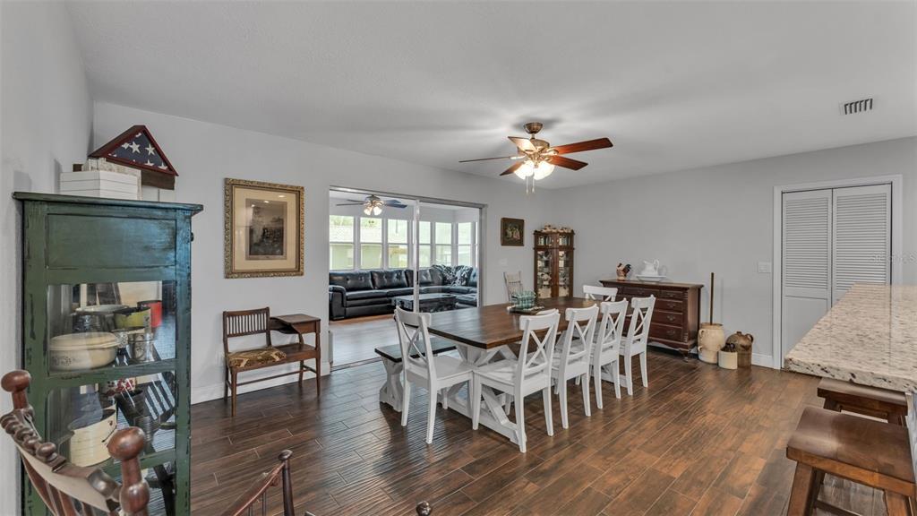 815 West Socrum Loop Road Lakeland, FL 33809 - Photo 11 of 41 a view of a dining room with furniture window and wooden floor