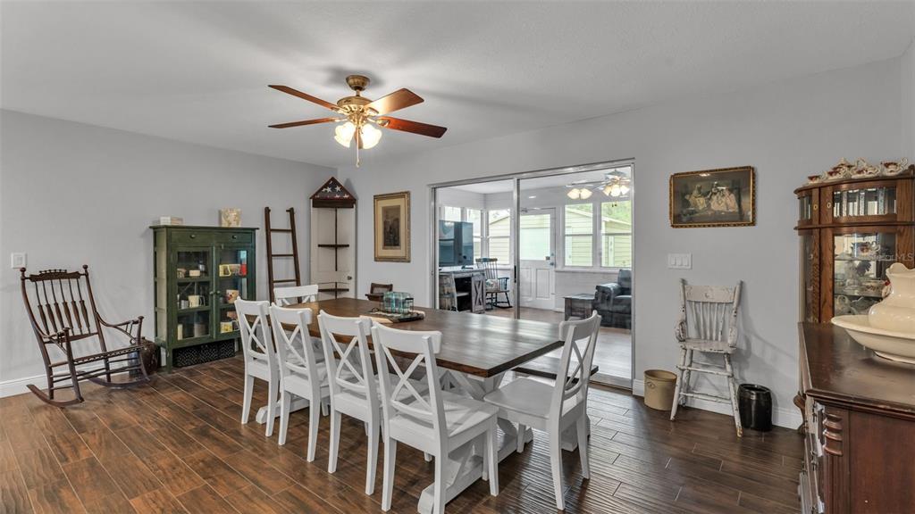 815 West Socrum Loop Road Lakeland, FL 33809 - Photo 12 of 41 a view of a dining room with furniture and wooden floor