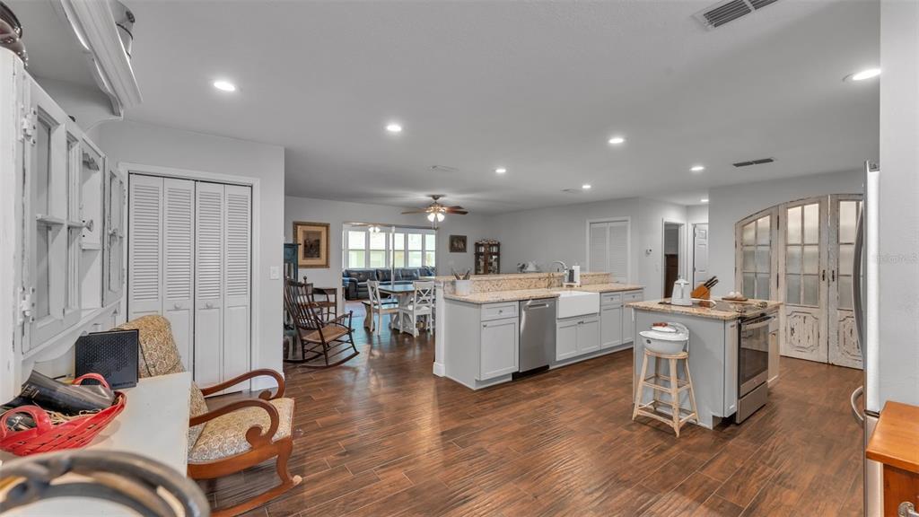 815 West Socrum Loop Road Lakeland, FL 33809 - Photo 13 of 41 a living room with furniture a wooden floor and a large window
