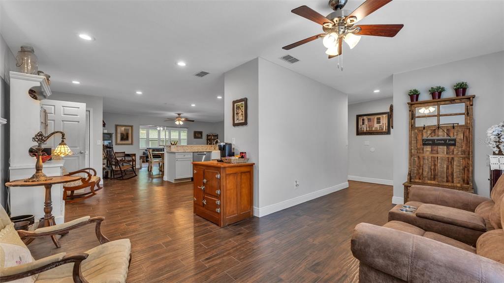 815 West Socrum Loop Road Lakeland, FL 33809 - Photo 16 of 41 a living room with furniture and wooden floor
