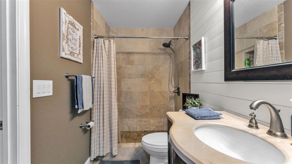 815 West Socrum Loop Road Lakeland, FL 33809 - Photo 20 of 41 a bathroom with a sink toilet and shower