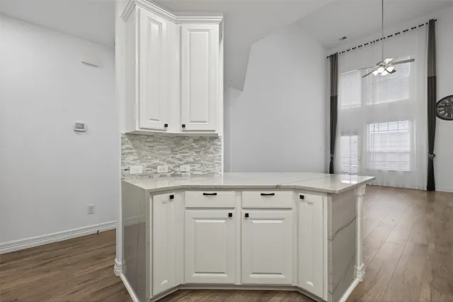 a view of cabinets with wooden floor