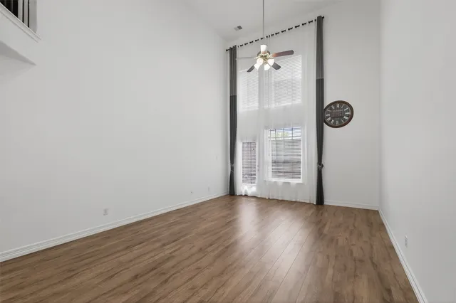 a view of a room with wooden floor