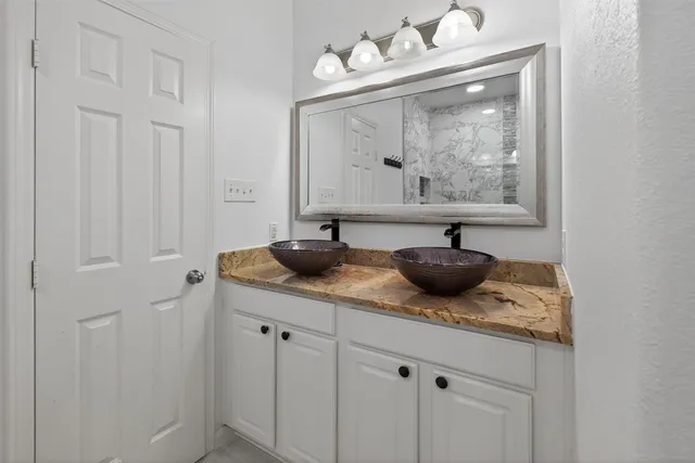 a room with furniture and mirror