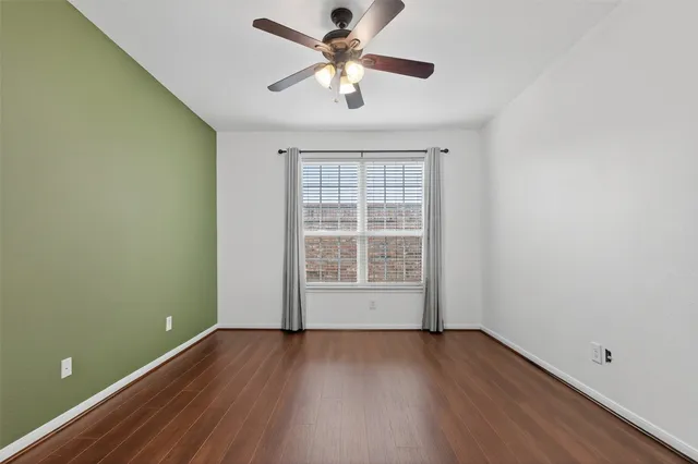 a view of staircase with railing and white walls