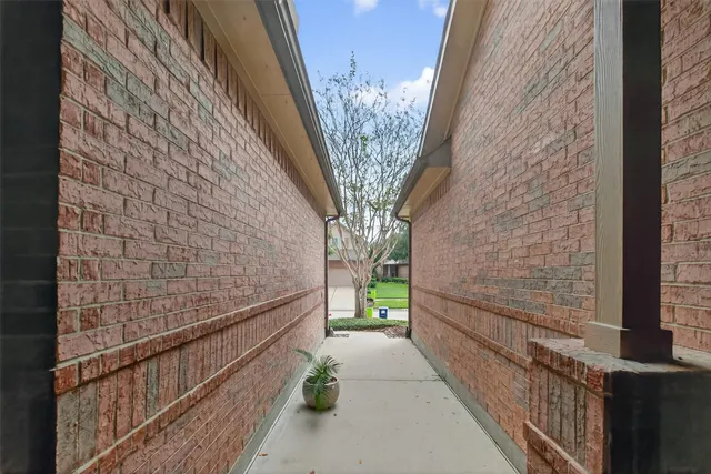 a view of a brick buildings with entryway doors