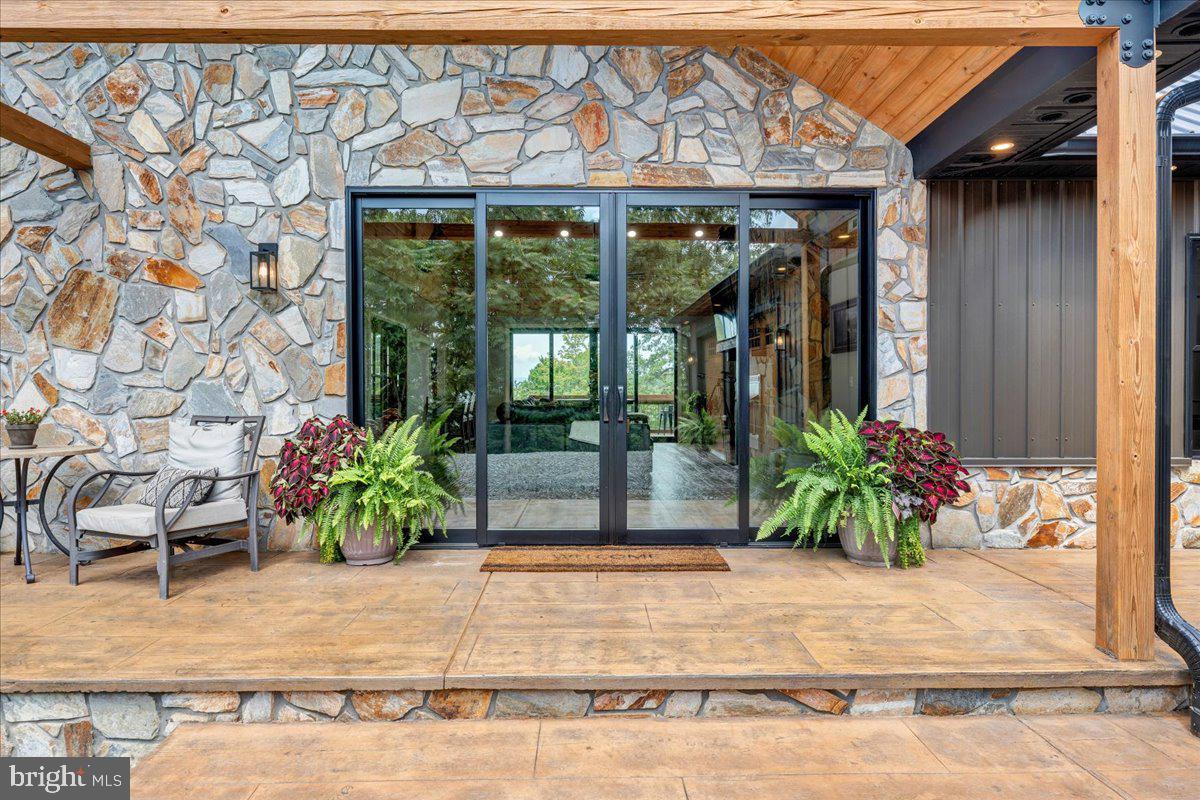 415 Grahams Farm Road Stuart, VA 24171 - Photo 70 of 121 Inviting stone entrance with lush greenery.