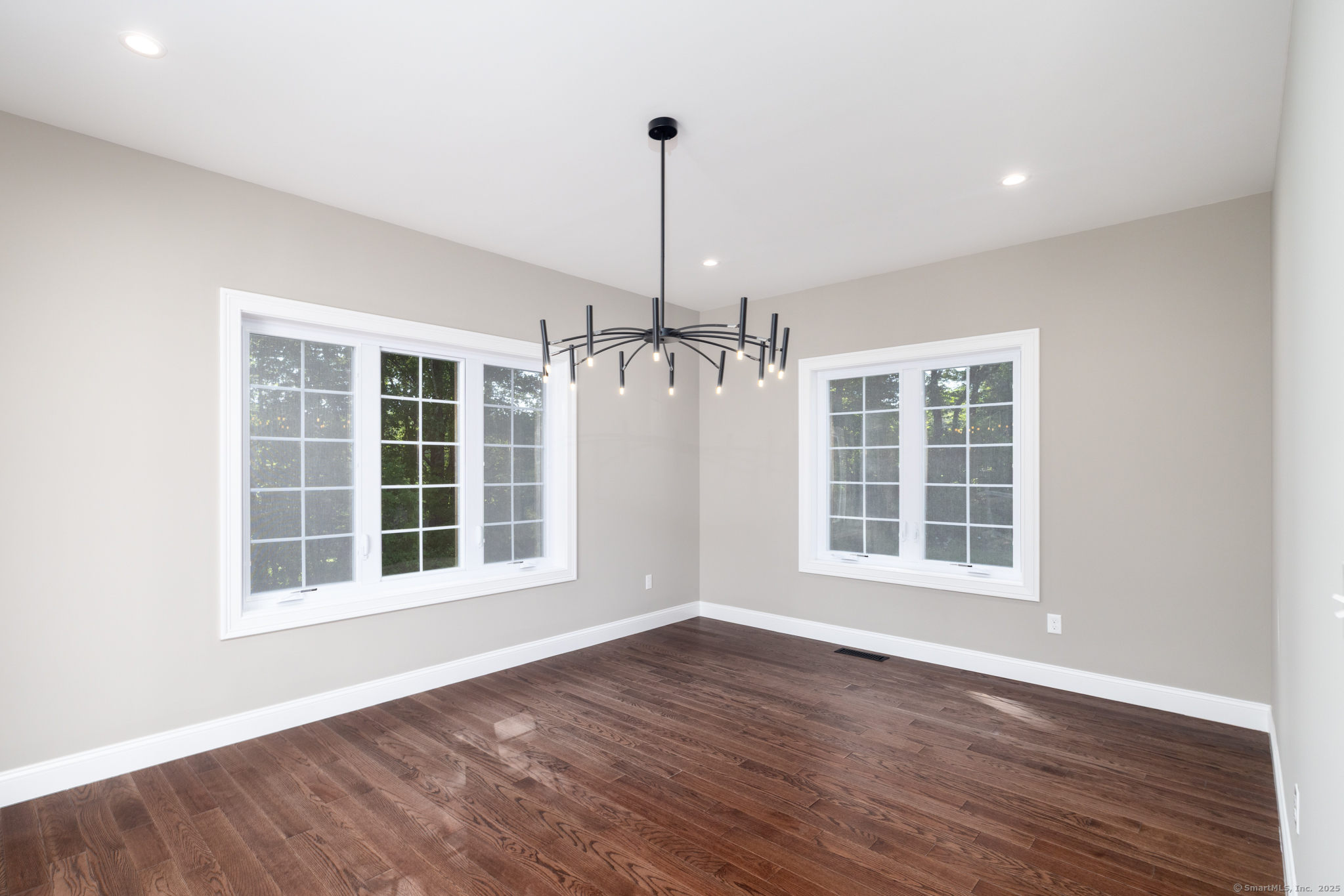 10 Maple View Trail Litchfield, CT 06759 - Photo 13 of 39 a view of an empty room with wooden floor and a window