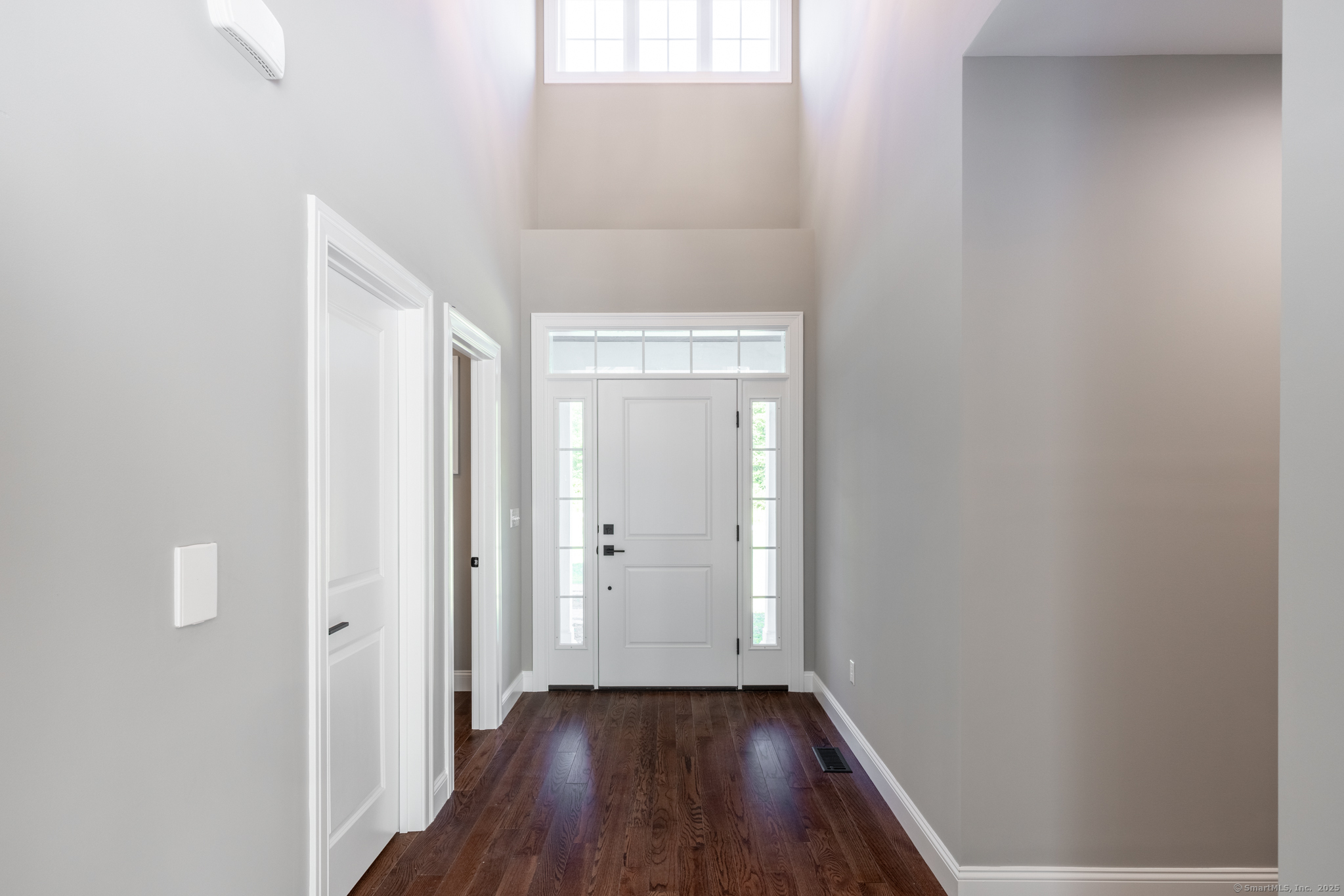 10 Maple View Trail Litchfield, CT 06759 - Photo 16 of 39 a view of a hallway with wooden floor