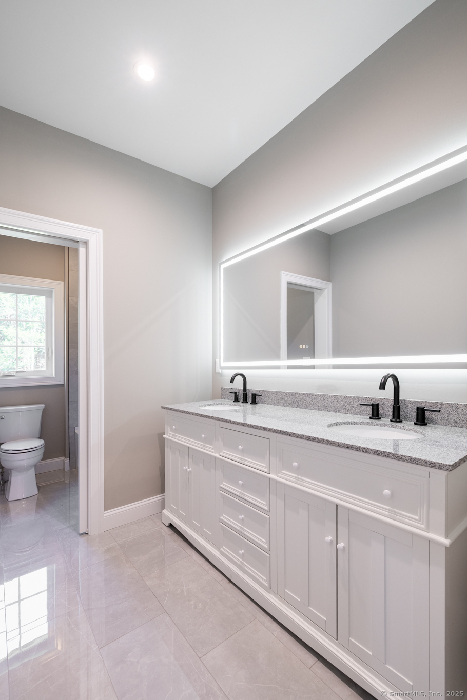 10 Maple View Trail Litchfield, CT 06759 - Photo 21 of 39 a bathroom with a granite countertop sink and a mirror