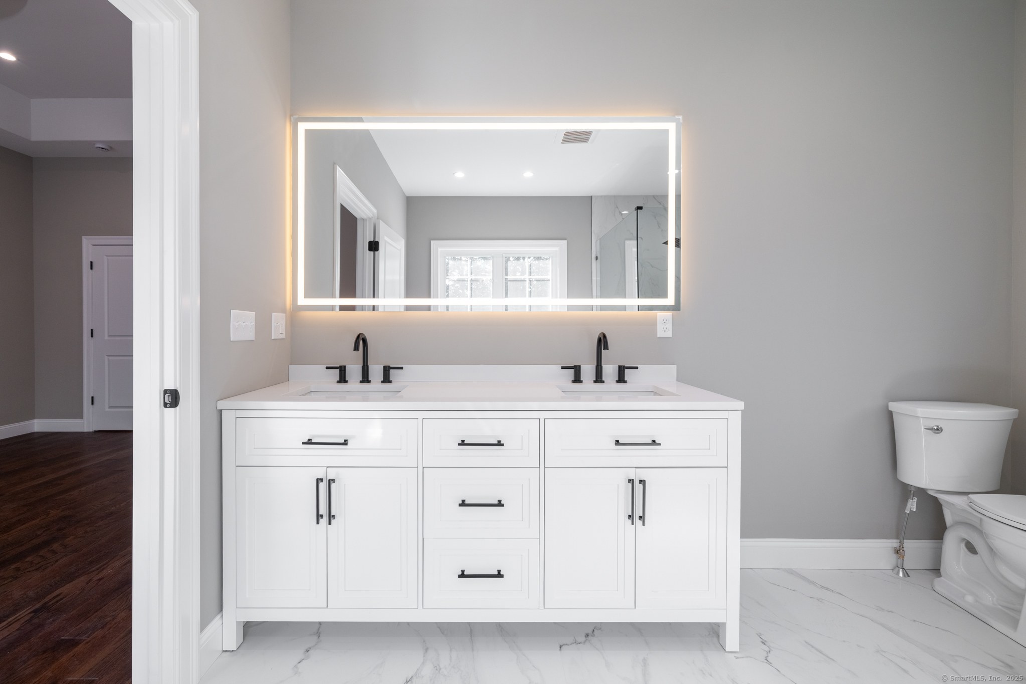 10 Maple View Trail Litchfield, CT 06759 - Photo 25 of 39 a bathroom with a double vanity sink and a toilet