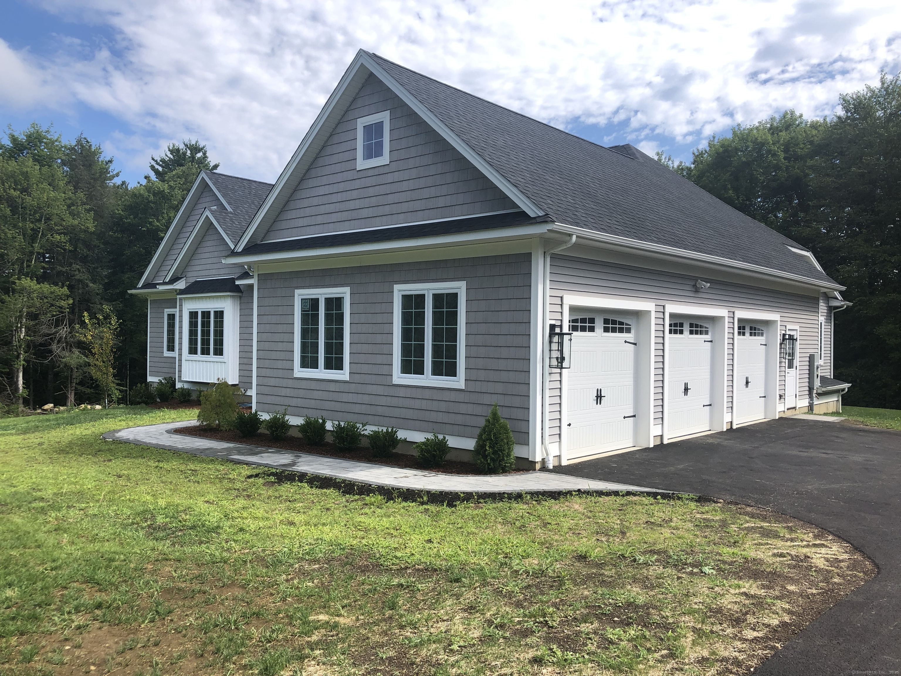 10 Maple View Trail Litchfield, CT 06759 - Photo 3 of 39 a front view of a house with a yard