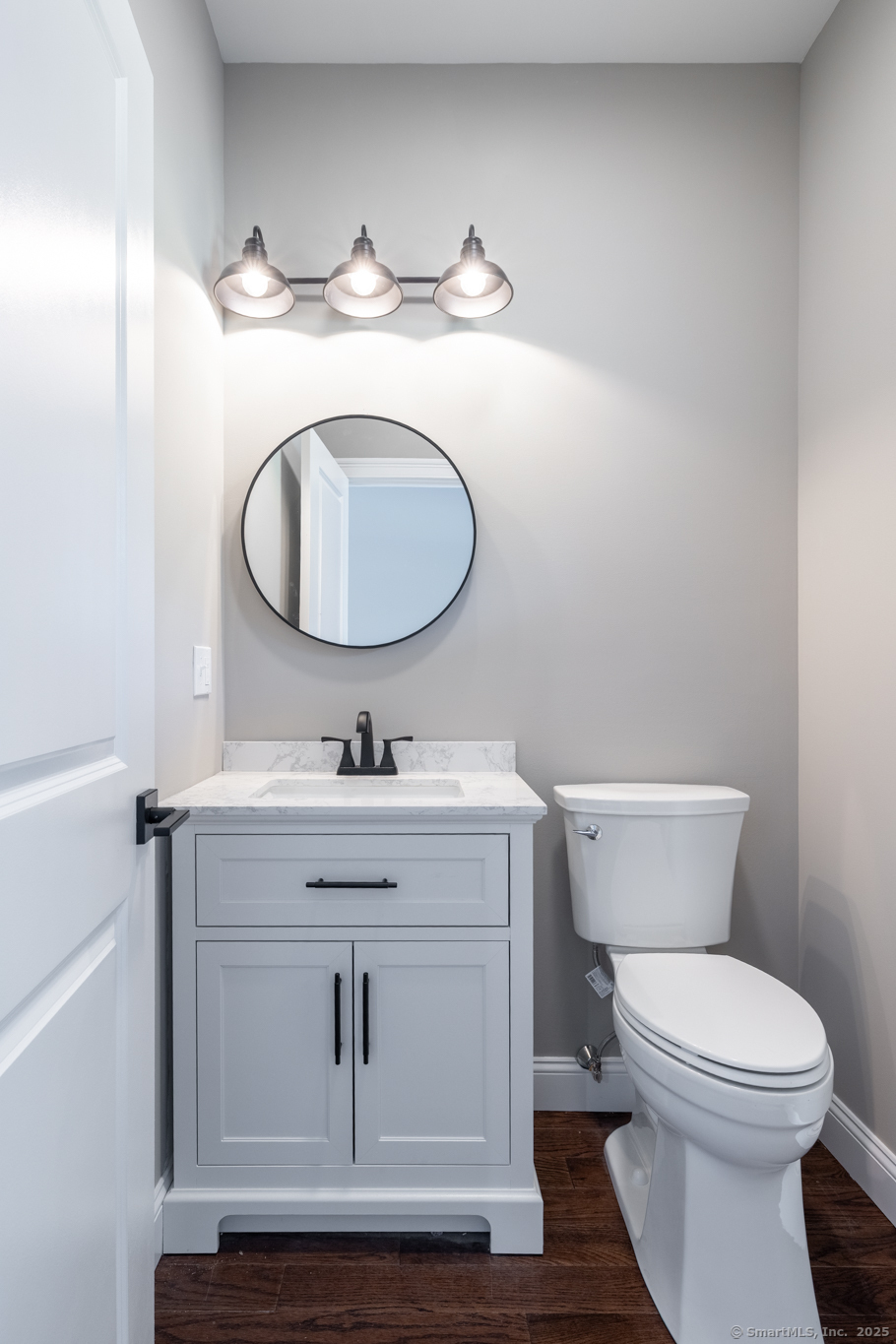 10 Maple View Trail Litchfield, CT 06759 - Photo 5 of 39 a bathroom with a toilet a sink and mirror