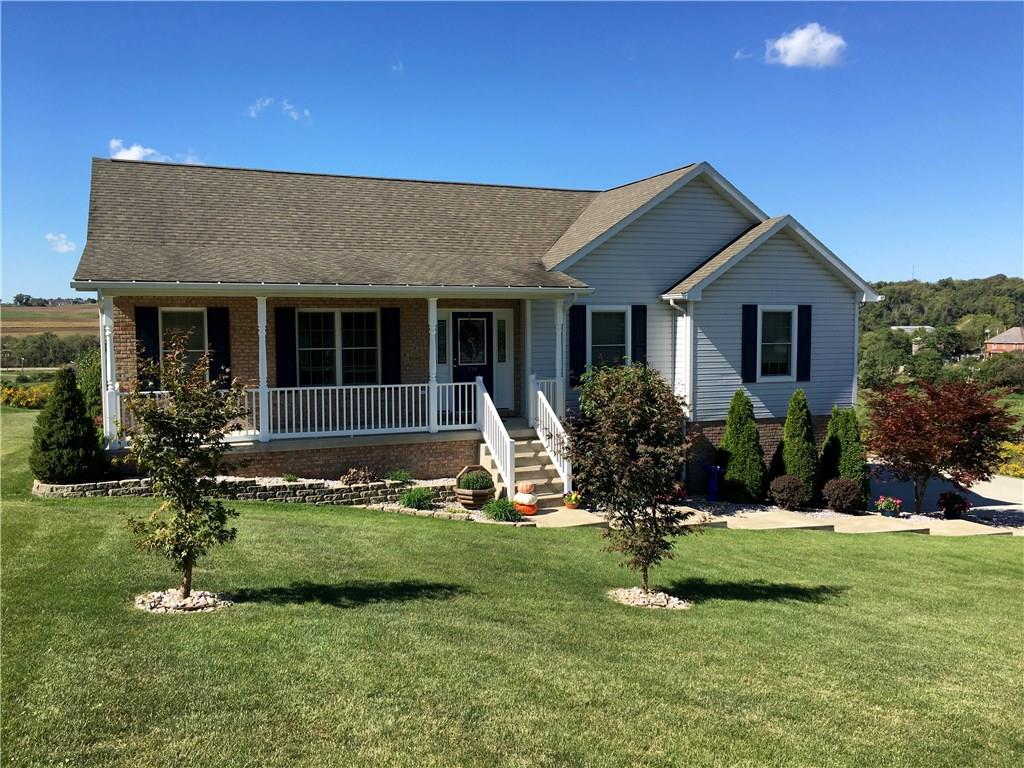 216 Grandma's Road Mount Pleasant, PA 15666 - Photo 1 of 25 Street view of the front with a great covered porch! The landscaping is well planned and meticulously maintained!
