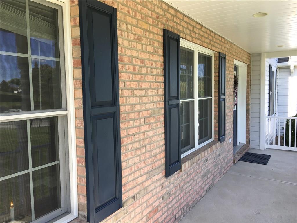 216 Grandma's Road Mount Pleasant, PA 15666 - Photo 8 of 25 The covered front porch is a perfect place to have some rocking chairs and just hang out and enjoy your new home.