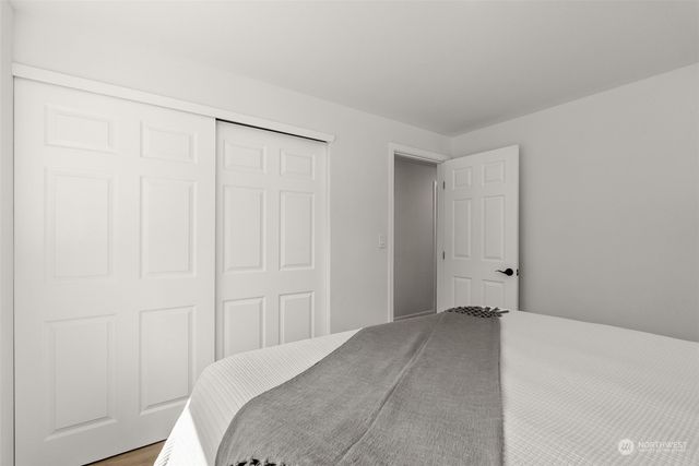 a bedroom with a bed and a shower