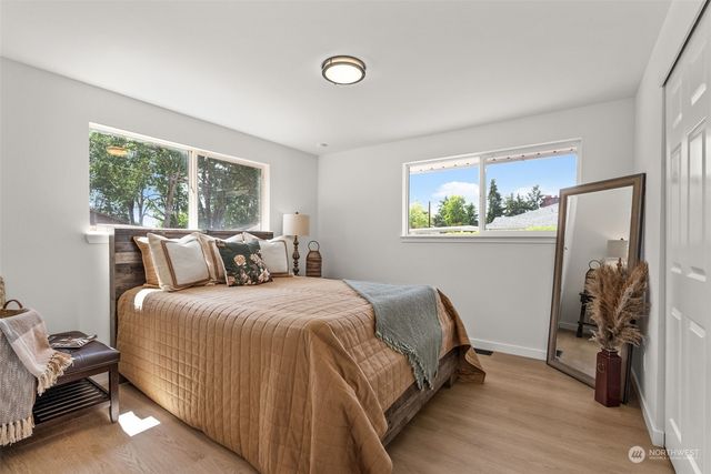 a bed room with a bed and a window