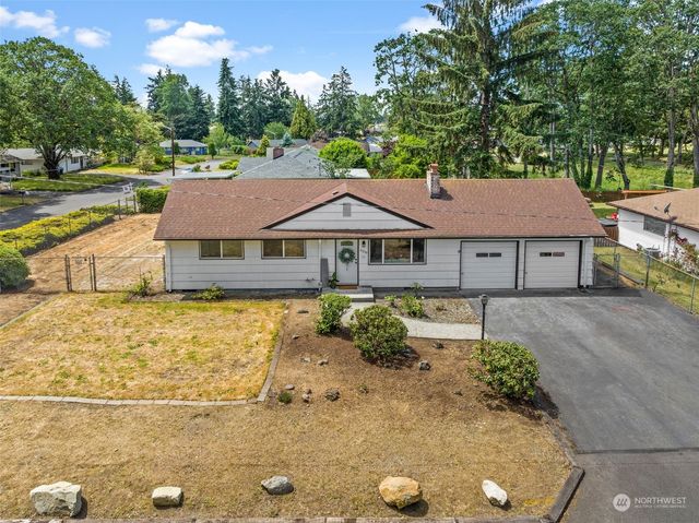 a aerial view of a house with a yard