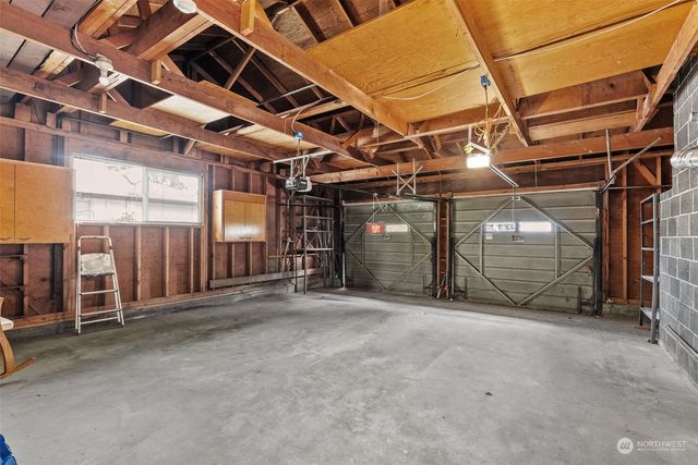 a view of an empty room with wooden walls