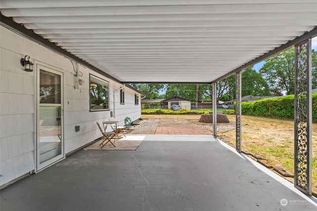 a view of a patio with a backyard
