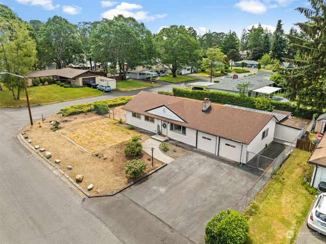 an aerial view of a house with outdoor space patio and swimming pool