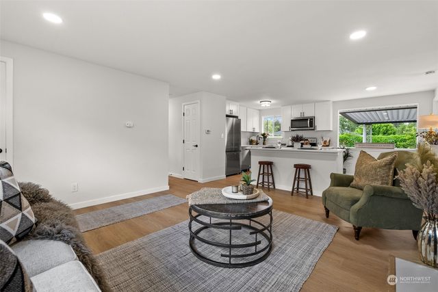 a living room with furniture and a table