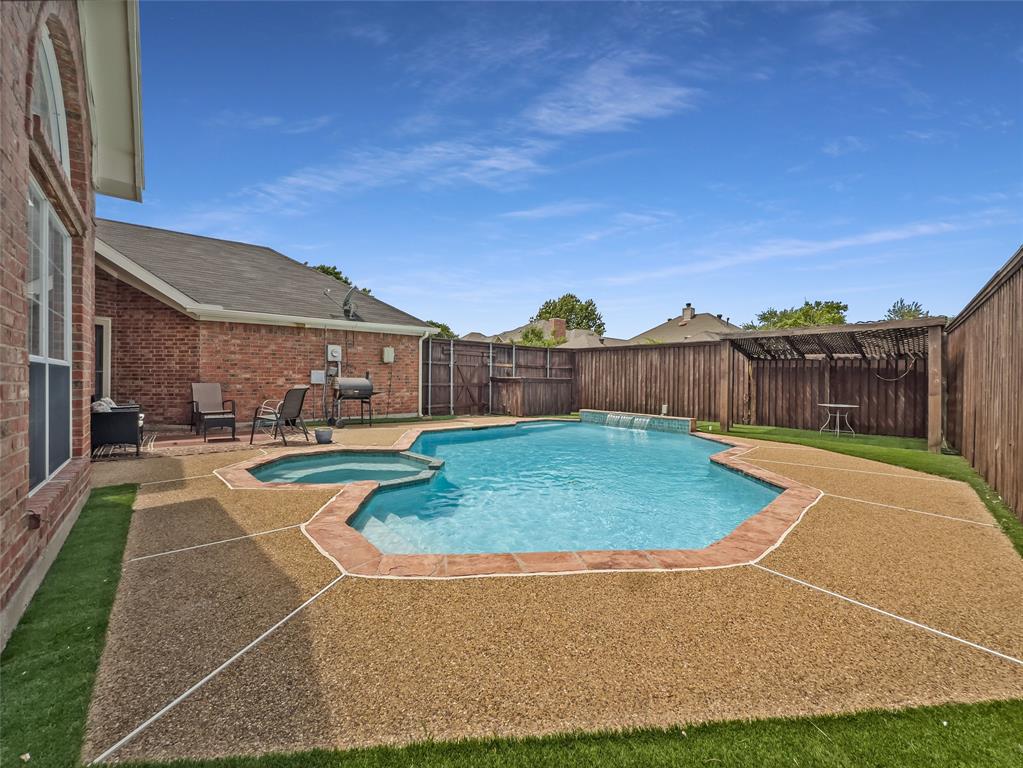 2317 Wellesly Road Rowlett, TX 75089 - Photo 32 of 39 a view of a swimming pool with a patio
