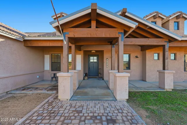 a kitchen with a table and chairs in it