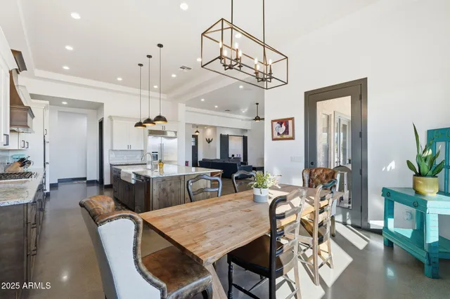 a bathroom with a granite countertop double vanity sink and a mirror