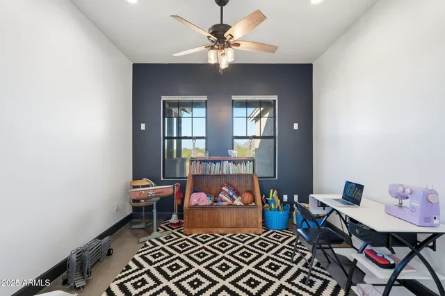 a view of a patio with a table and chairs
