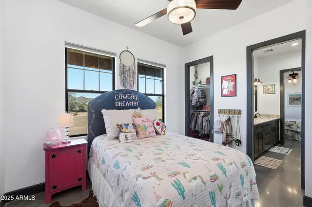 a view of a patio with table and chairs with wooden floor and fence