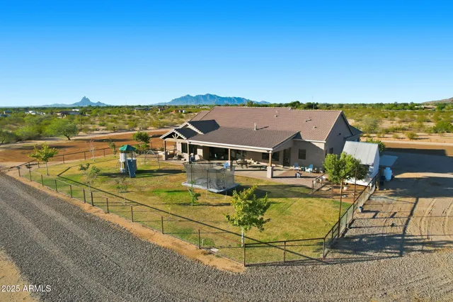 an aerial view of a house with a ocean view