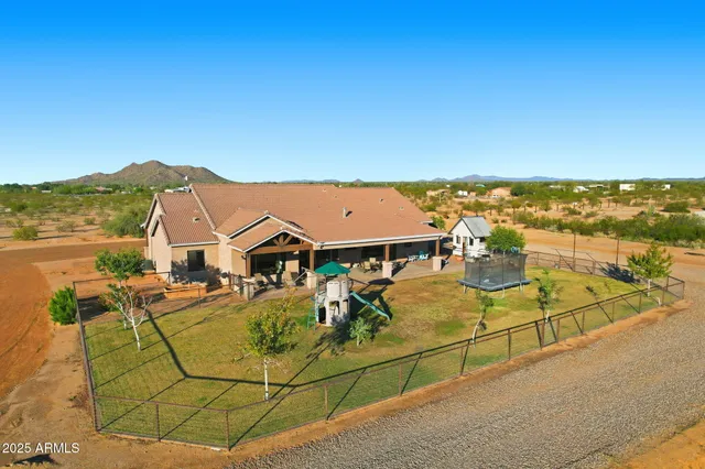 an aerial view of residential building and lake