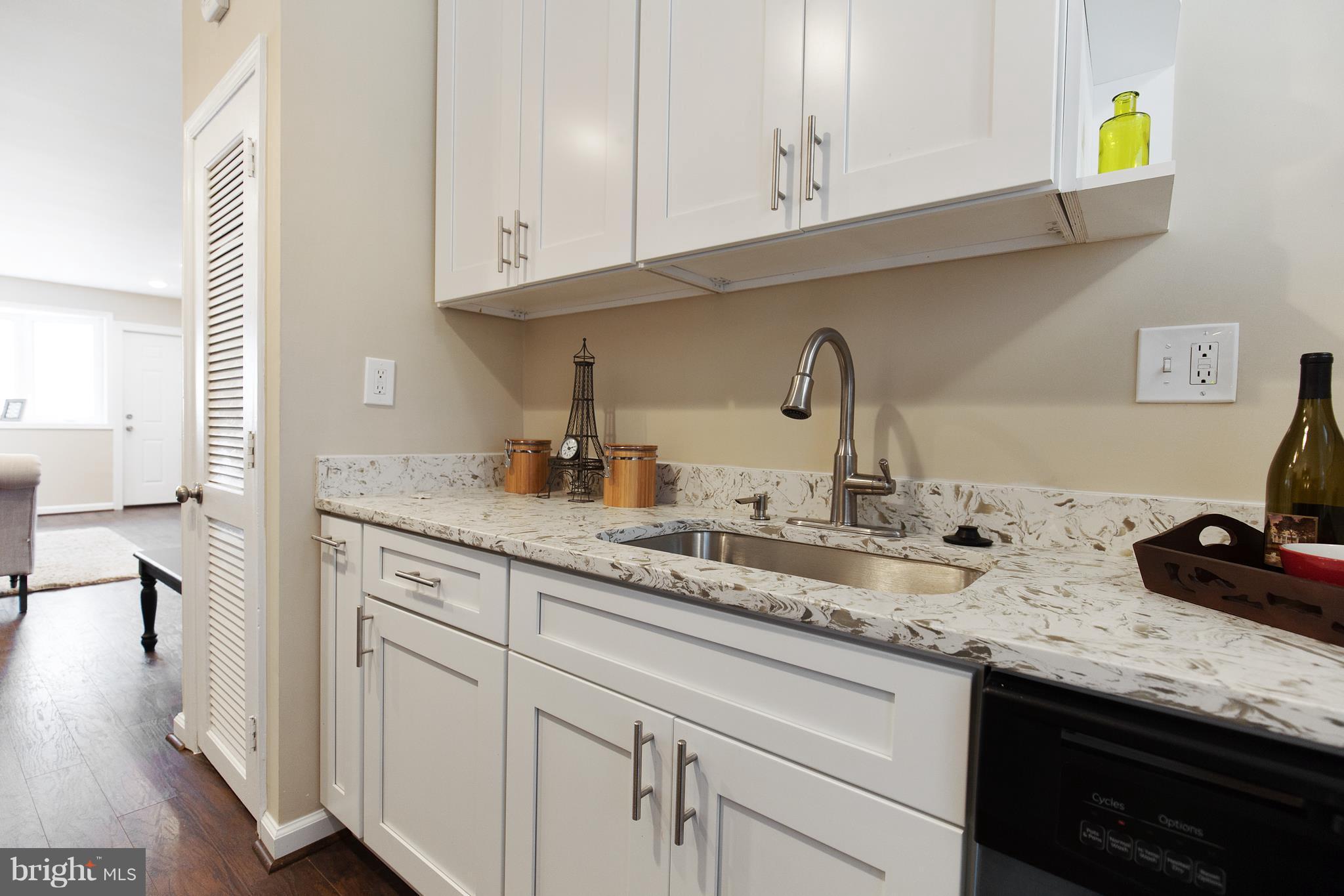 7700 Muncy Road Landover, MD 20785 - Photo 14 of 29 a kitchen with sink and cabinets