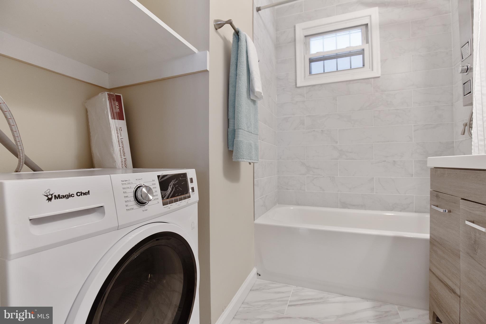 7700 Muncy Road Landover, MD 20785 - Photo 24 of 29 a bathroom with a bathtub and a shower