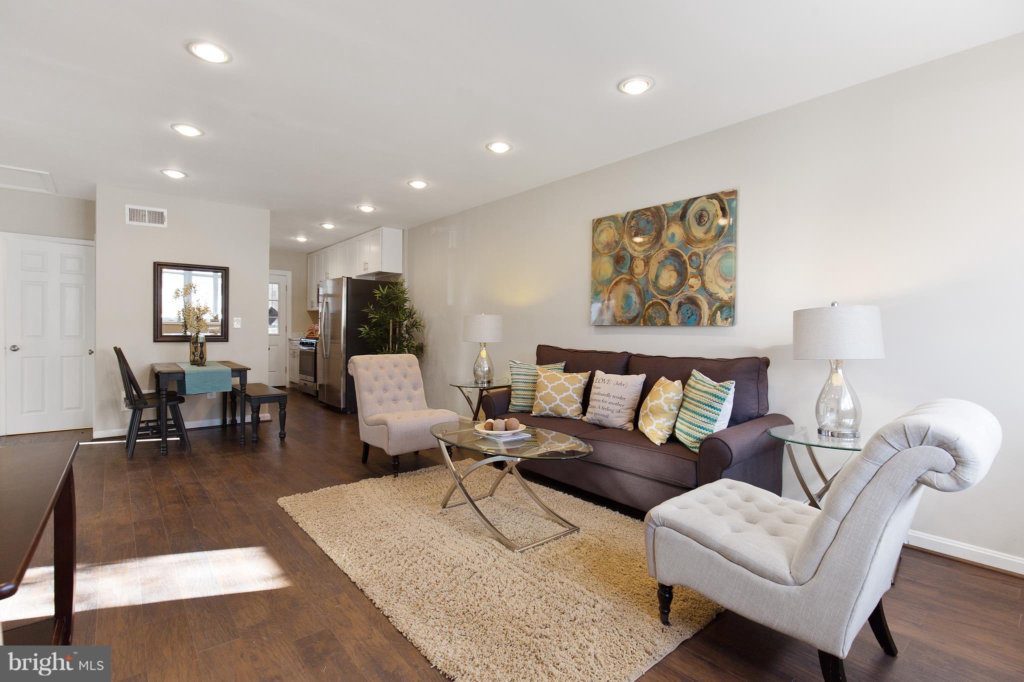 7700 Muncy Road Landover, MD 20785 - Photo 4 of 29 a living room with furniture and wooden floor