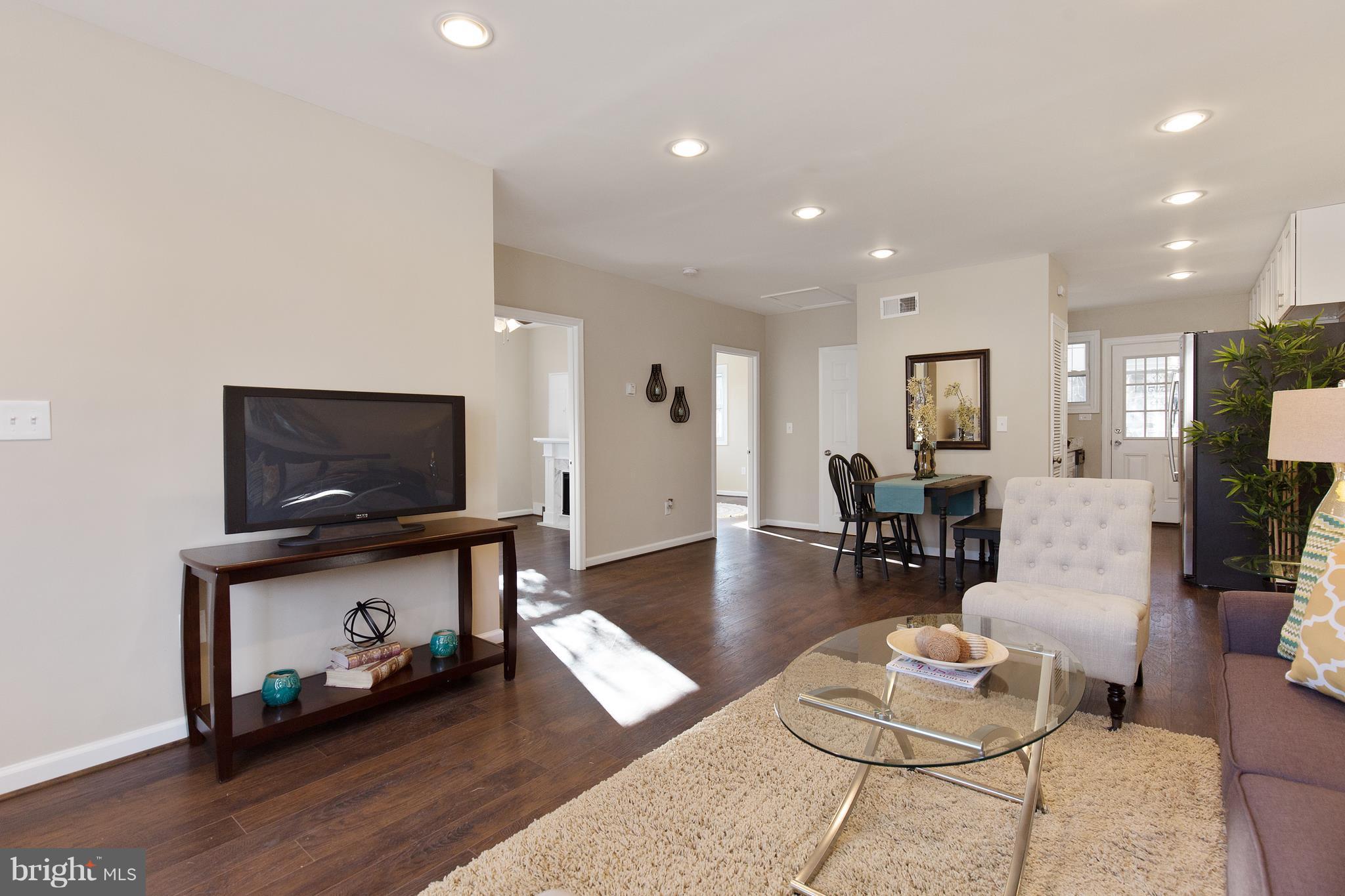 7700 Muncy Road Landover, MD 20785 - Photo 5 of 29 a living room with furniture and a flat screen tv