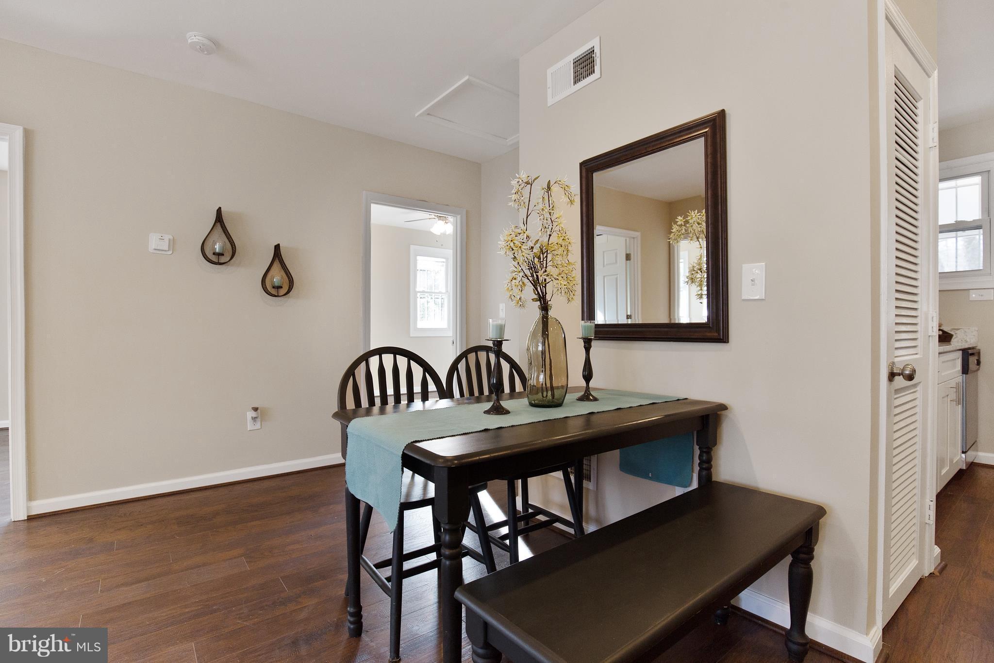 7700 Muncy Road Landover, MD 20785 - Photo 7 of 29 a view of a dining room with furniture and wooden floor