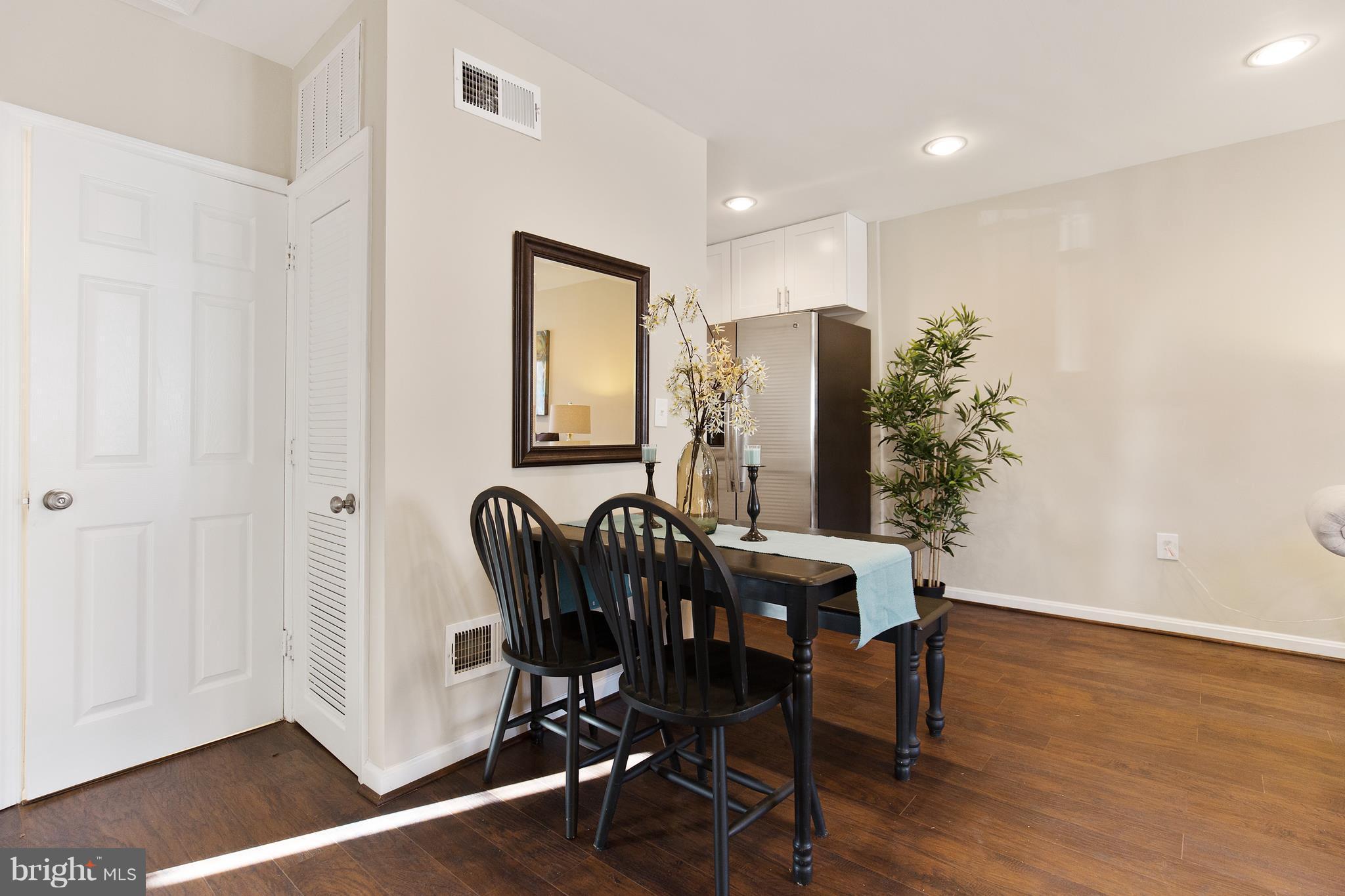 7700 Muncy Road Landover, MD 20785 - Photo 8 of 29 a view of a dining room with furniture and wooden floor
