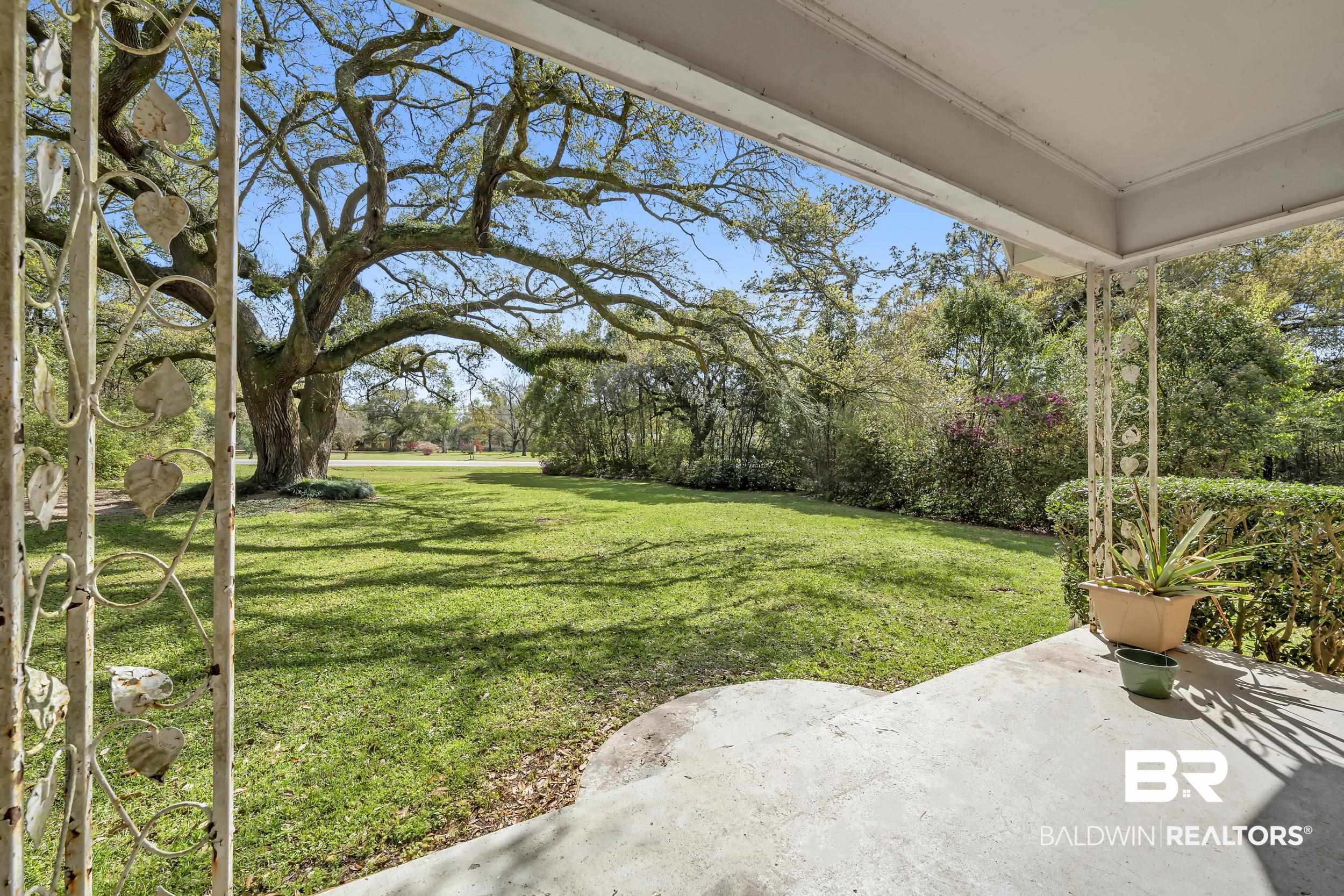 17463 Highway 98 Foley, AL 36535 - Photo 22 of 57 View of grassy yard with a patio area