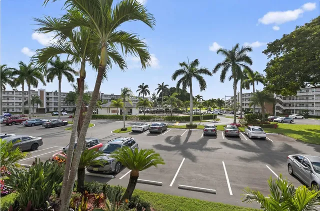a view of a swimming pool with furniture